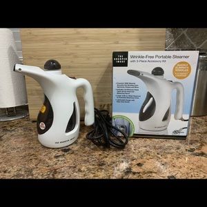 The Sharper Image Portable Handheld Steamer.
